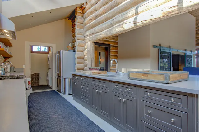 a bedroom with bed and wooden floor