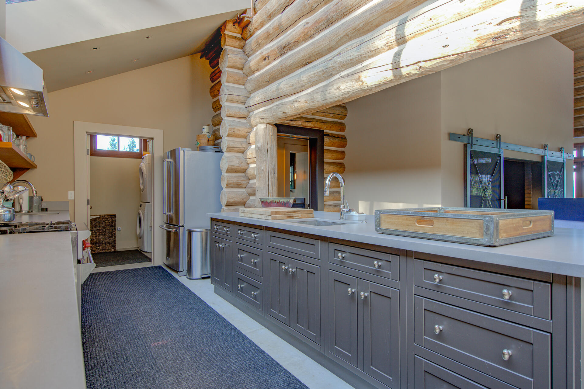 21151 Ridge Road Hat Creek, CA 96040 - Photo 26 of 68 a spacious bathroom with a granite countertop sink and a mirror