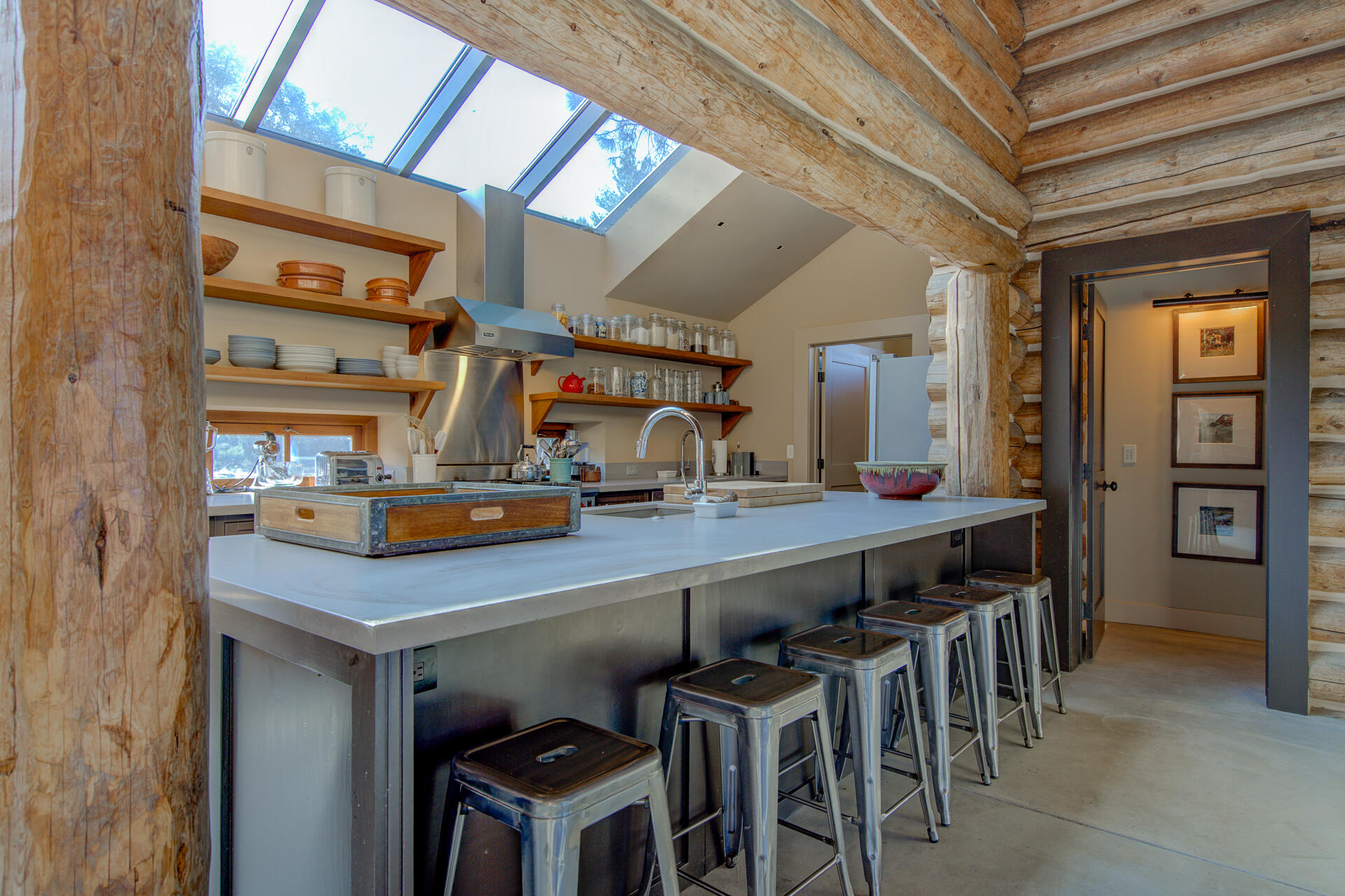 21151 Ridge Road Hat Creek, CA 96040 - Photo 29 of 68 a room with stainless steel appliances lots of wooden furniture dining table and chairs