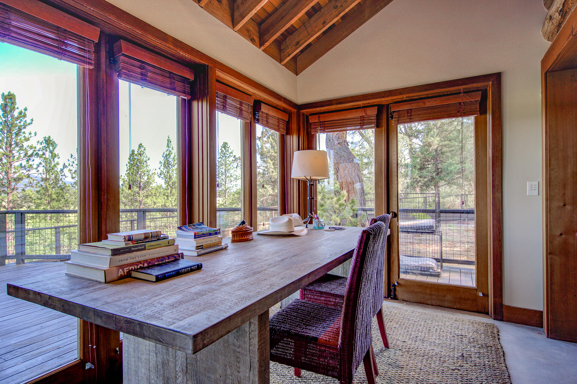 21151 Ridge Road Hat Creek, CA 96040 - Photo 44 of 68 a view of a dining room with furniture large windows and wooden floor