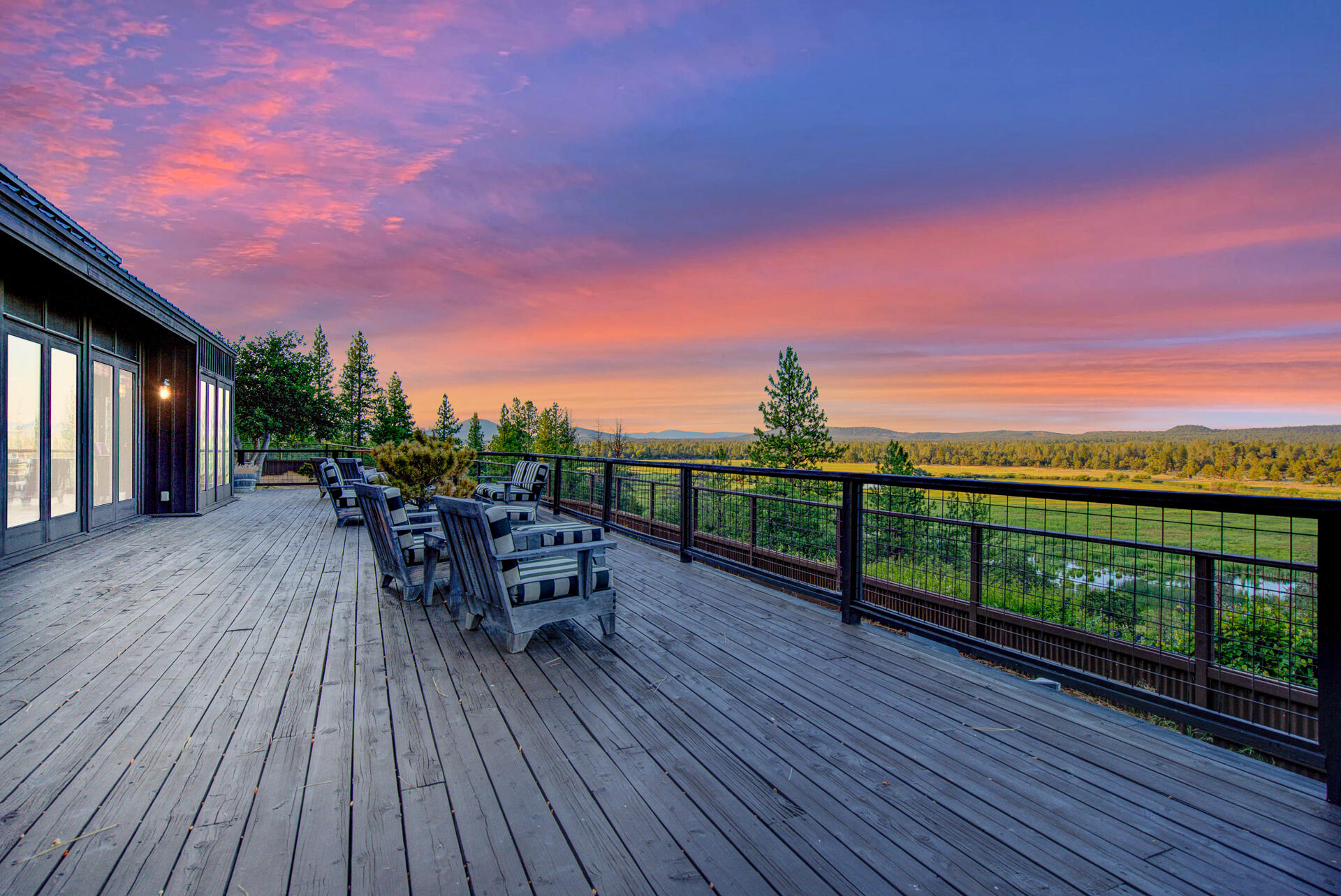 21151 Ridge Road Hat Creek, CA 96040 - Photo 5 of 68 a view of a balcony with furniture and wooden floor