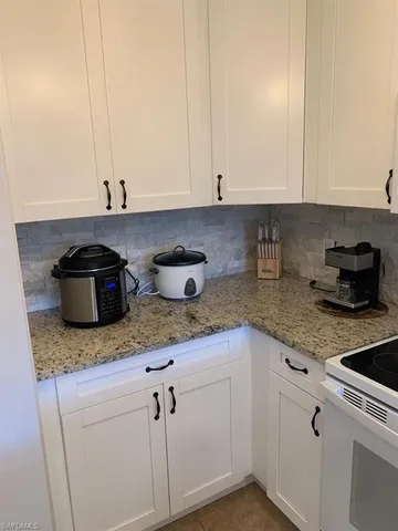 a bedroom with double bed and a window