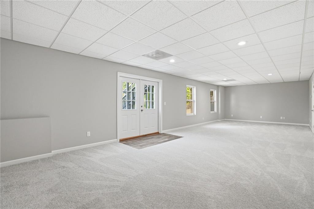 7812 Keepsake Lane Flowery Branch, GA 30542 - Photo 25 of 78 a view of an empty room with a window