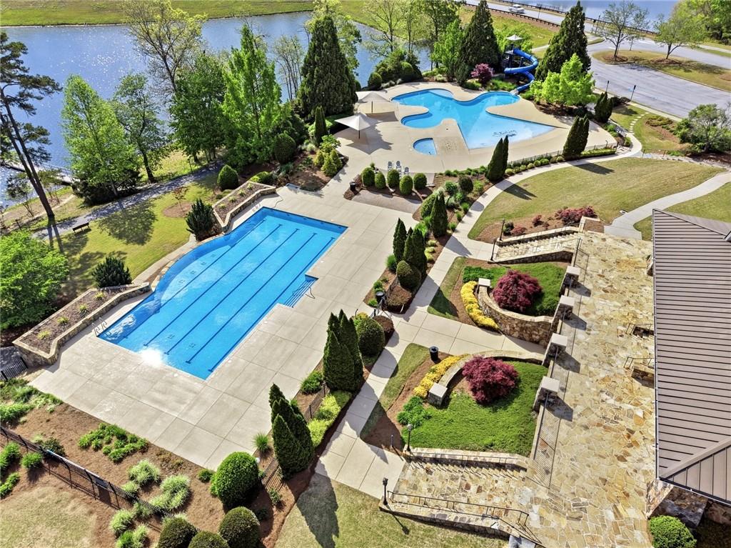 7812 Keepsake Lane Flowery Branch, GA 30542 - Photo 36 of 78 an aerial view of a house with a garden and lake view