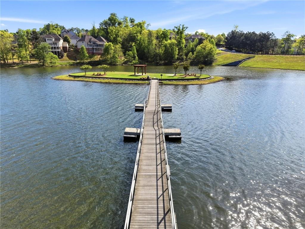 7812 Keepsake Lane Flowery Branch, GA 30542 - Photo 48 of 78 a view of a swimming pool with a lake view