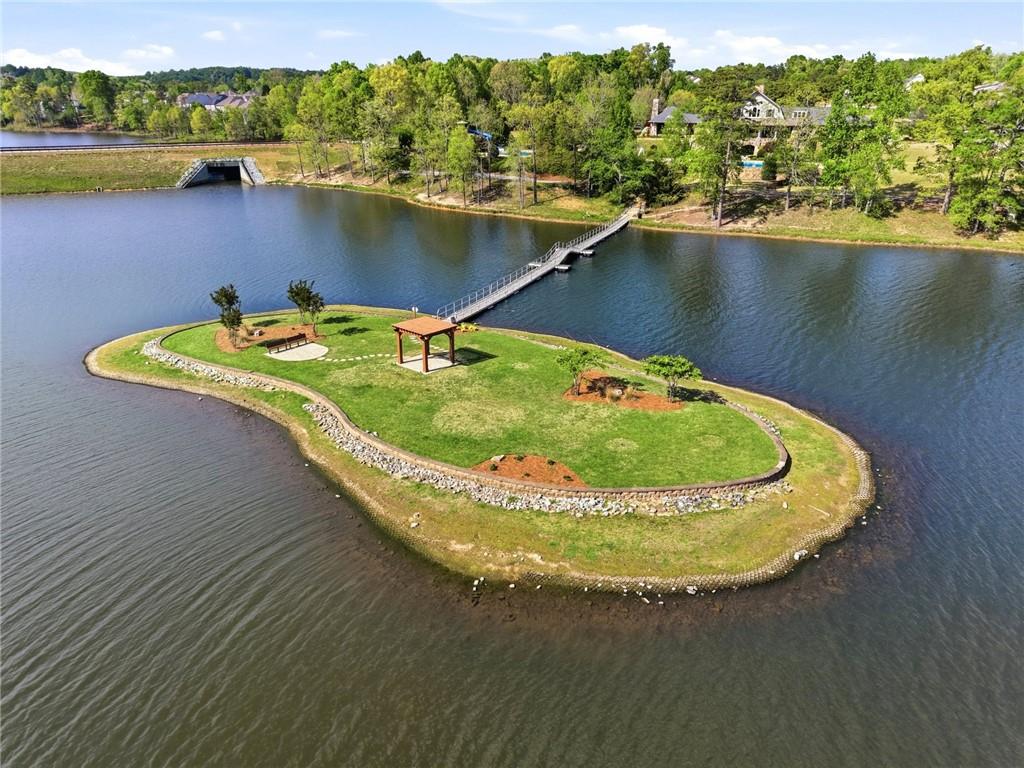 7812 Keepsake Lane Flowery Branch, GA 30542 - Photo 50 of 78 an aerial view of a house with outdoor space swimming pool and lake view