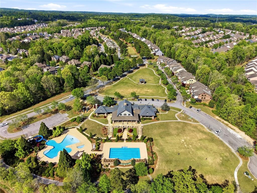7812 Keepsake Lane Flowery Branch, GA 30542 - Photo 52 of 78 an aerial view of residential houses with outdoor space and swimming pool