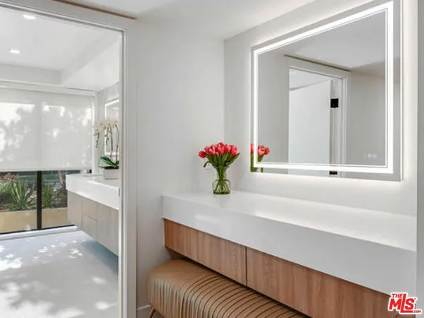 a bathroom with a double vanity sink and a bathtub