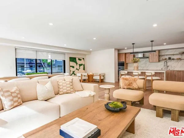 a living room with furniture and a table