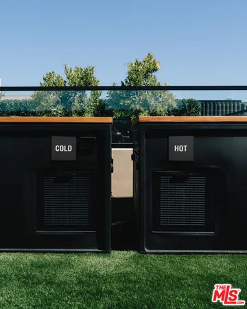 a view of a patio with couches table and chairs and potted plants