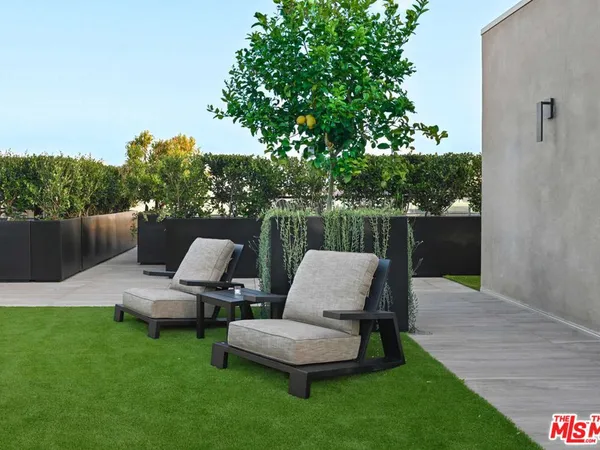 a view of a tables and chairs in patio
