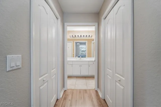 a spacious bathroom with a double vanity sink and a mirror