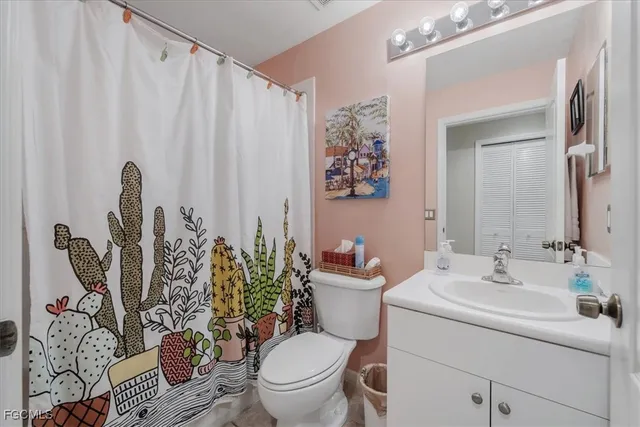 a bedroom with two beds and a window