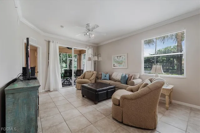 a living room with a table and chairs