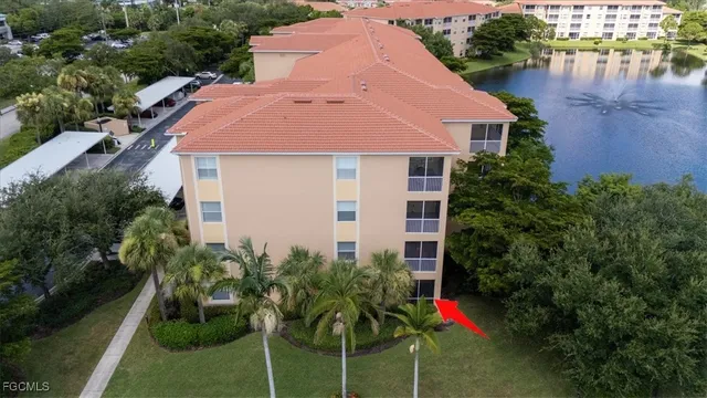 a view of a swimming pool with a patio and garden