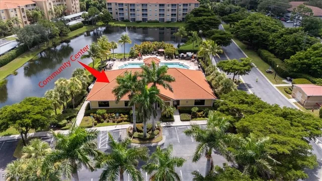 an aerial view of residential houses with outdoor space and ocean view
