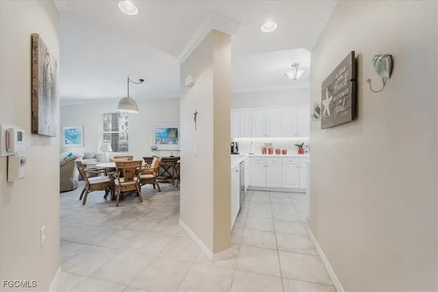 a kitchen with cabinets appliances a sink and a counter top space