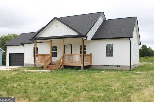 a house that has a big yard in front of it