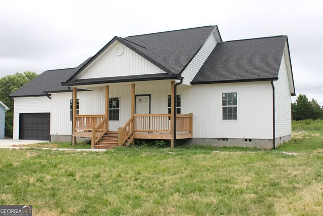 a house that has a big yard in front of it