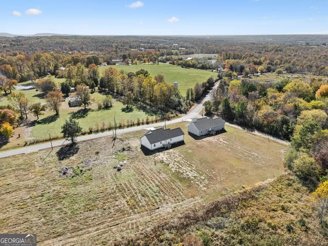 a view of a field with an ocean