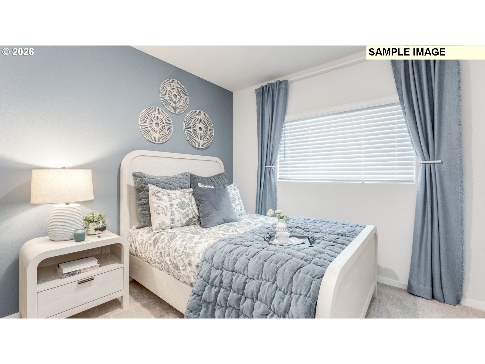 134 Coho Loop Woodland, WA 98674 - Photo 13 of 23 a bedroom with a bed and a lamp