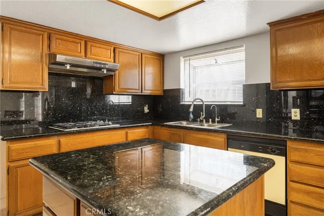 a front view of a house with a yard porch and outdoor seating