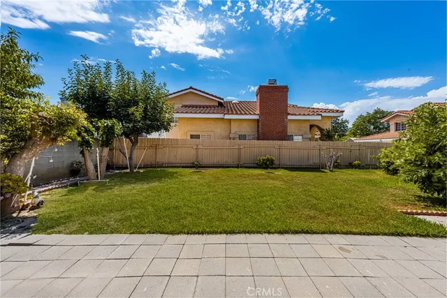 a view of a room with wooden floor and staircase
