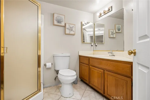 a view of a living room with furniture and a wooden floor