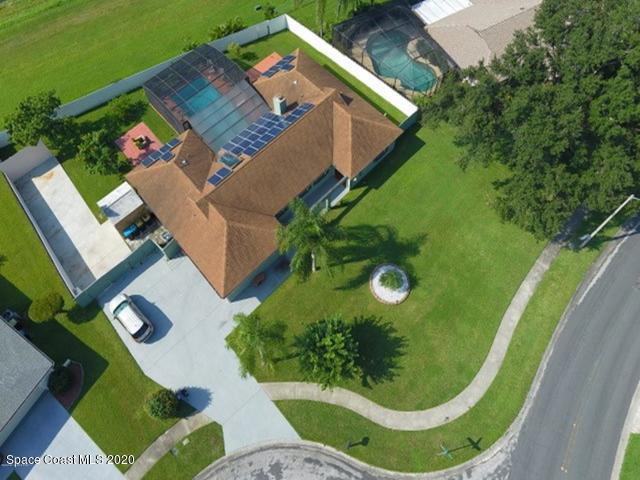 1554 Meadowbrook Road Northeast Palm Bay, FL 32905 - Photo 2 of 37 an aerial view of a house