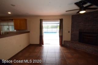 1554 Meadowbrook Road Northeast Palm Bay, FL 32905 - Photo 19 of 37 a view of a hallway with a kitchen