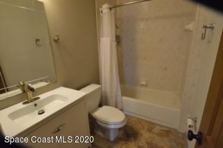 1554 Meadowbrook Road Northeast Palm Bay, FL 32905 - Photo 20 of 37 a bathroom with a sink a toilet and shower