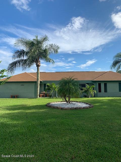 1554 Meadowbrook Road Northeast Palm Bay, FL 32905 - Photo 5 of 37 a view of a backyard