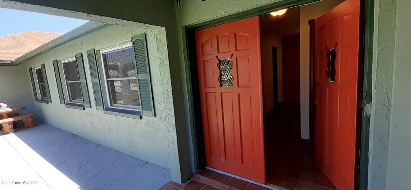 1554 Meadowbrook Road Northeast Palm Bay, FL 32905 - Photo 6 of 37 a view of front door