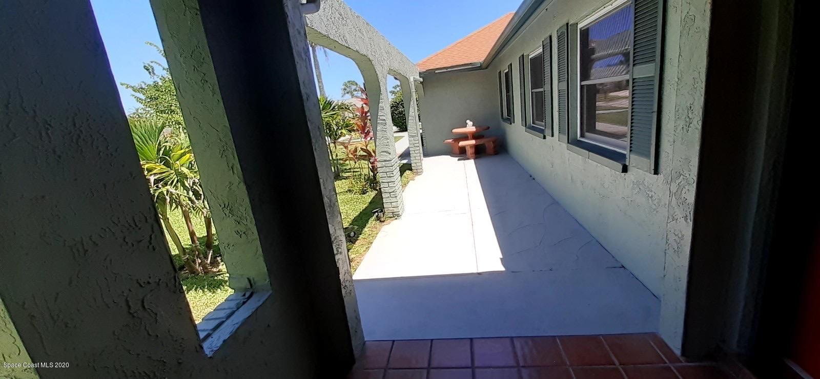 1554 Meadowbrook Road Northeast Palm Bay, FL 32905 - Photo 7 of 37 a view of an entryway