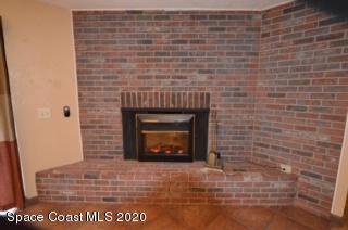 1554 Meadowbrook Road Northeast Palm Bay, FL 32905 - Photo 10 of 37 a brick oven with a fireplace