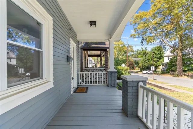 a front view of a house with outdoor seating
