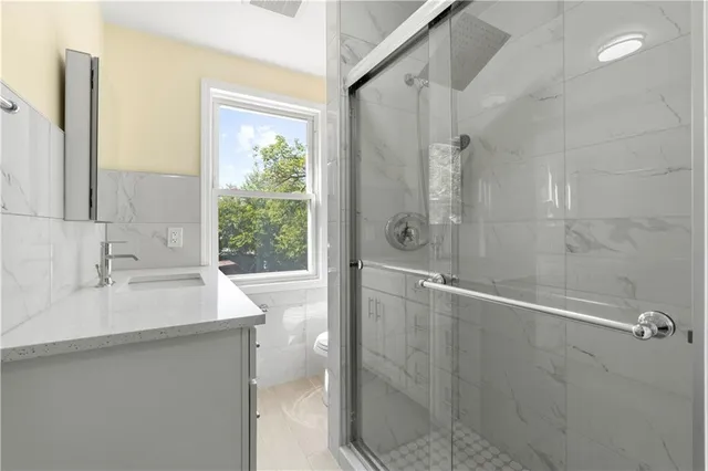 a white bath tub sitting next to a white sink