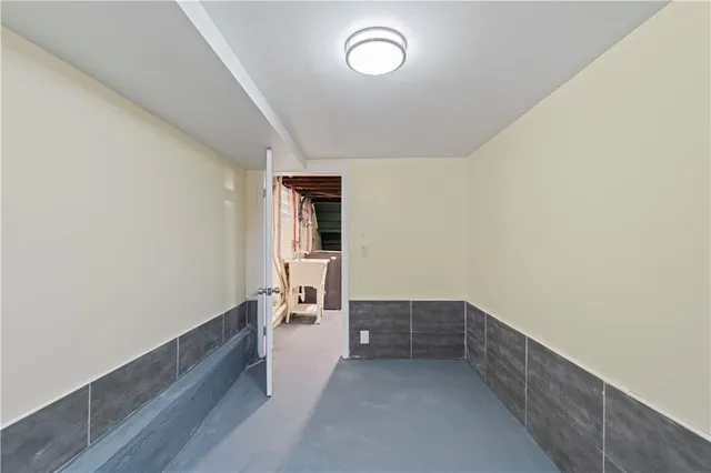 a bathroom with a sink a mirror and shower