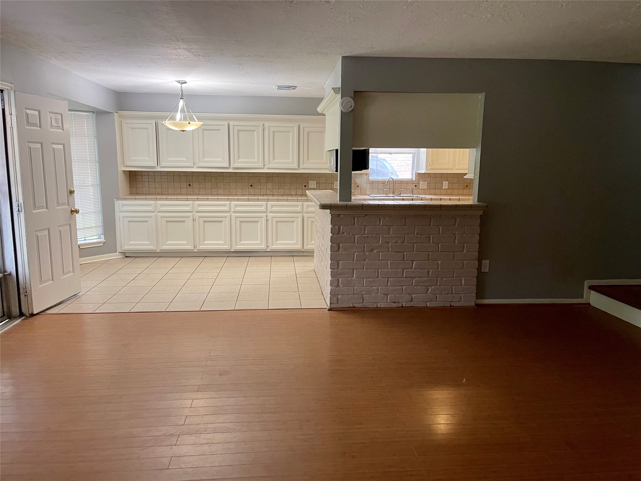 15803 Baytree Drive Houston, TX 77070 - Photo 12 of 23 a view of kitchen with wooden floor