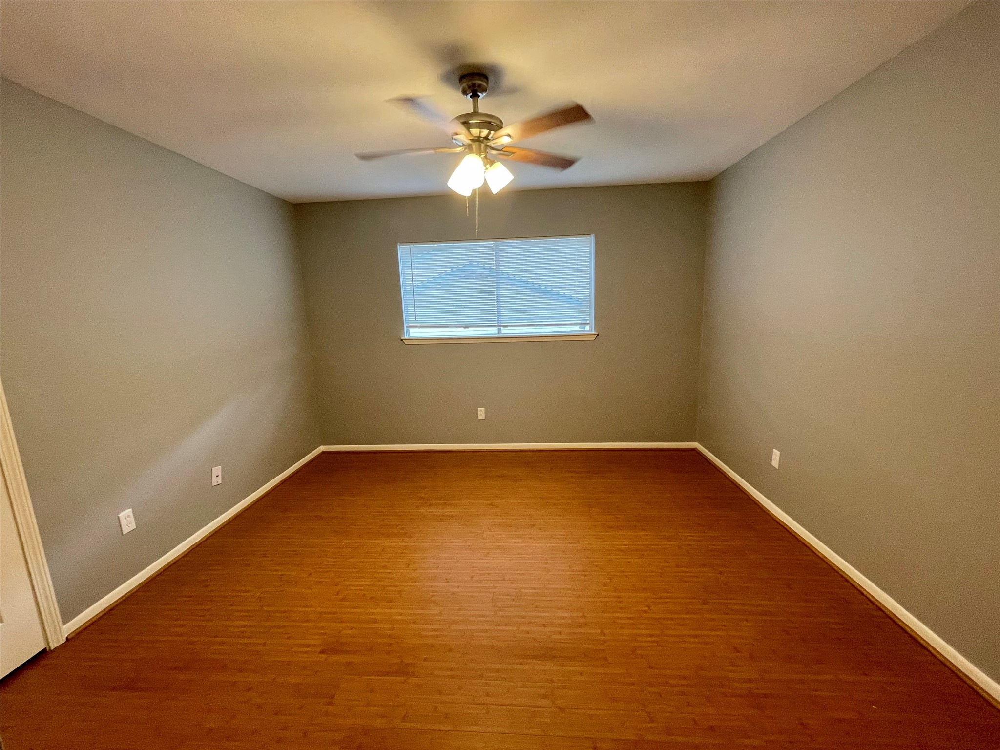 15803 Baytree Drive Houston, TX 77070 - Photo 16 of 23 a view of a room with window and ceiling fan