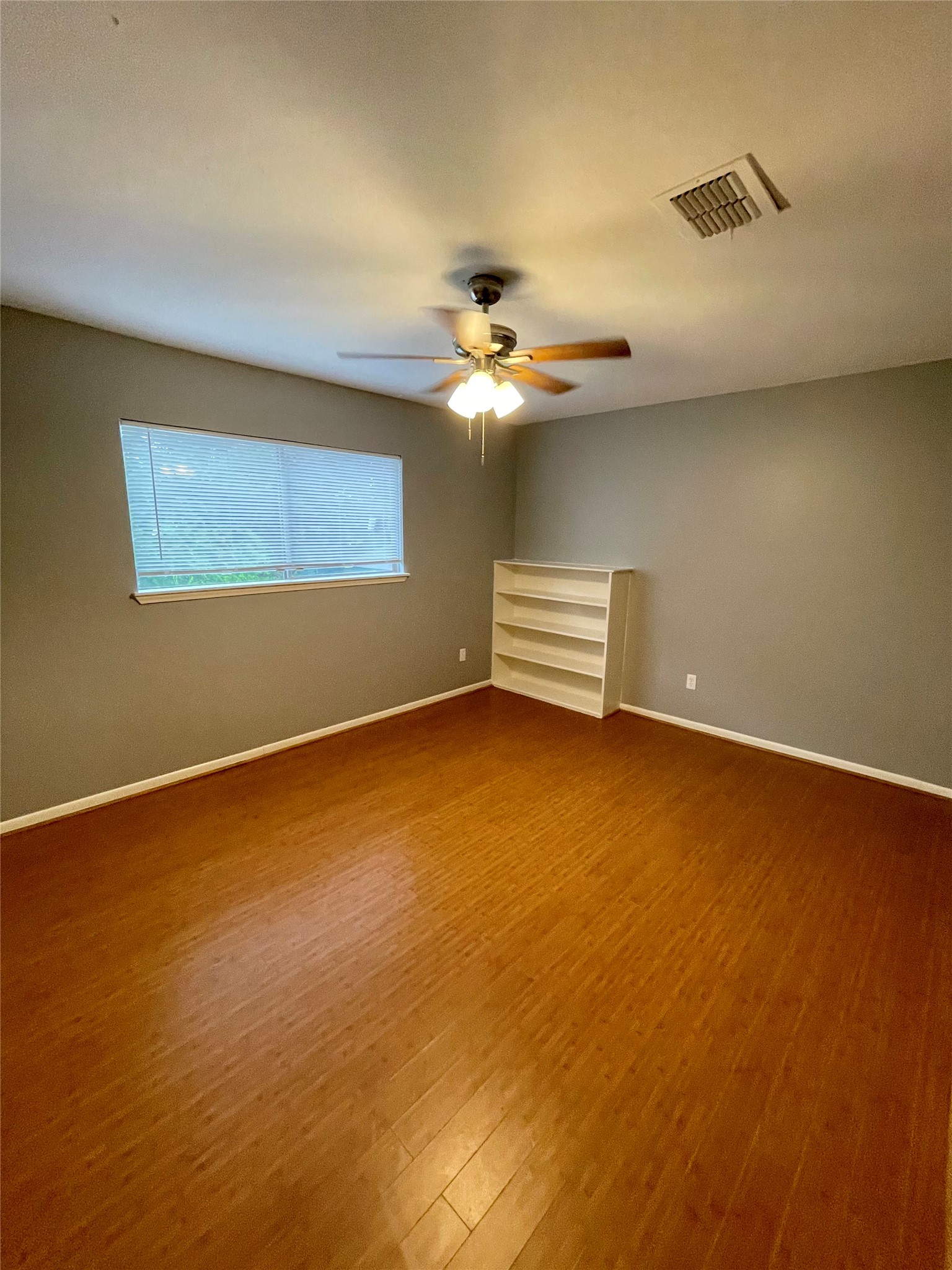 15803 Baytree Drive Houston, TX 77070 - Photo 18 of 23 a view of room with ceiling fan and window