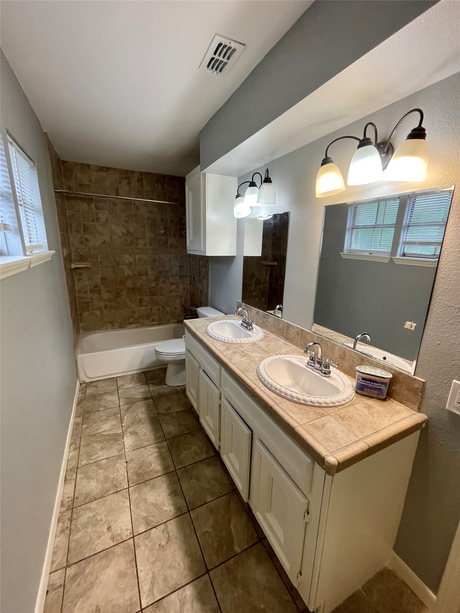 15803 Baytree Drive Houston, TX 77070 - Photo 20 of 23 a bathroom with a sink and a mirror