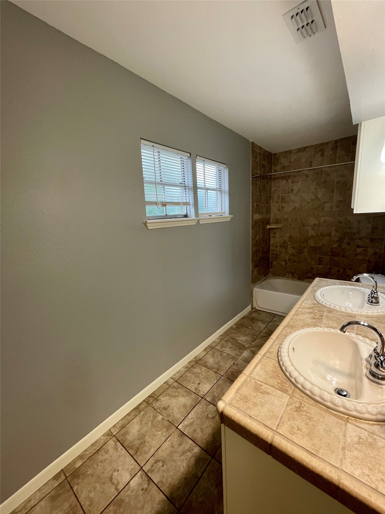 15803 Baytree Drive Houston, TX 77070 - Photo 21 of 23 a bathroom with a sink and a mirror