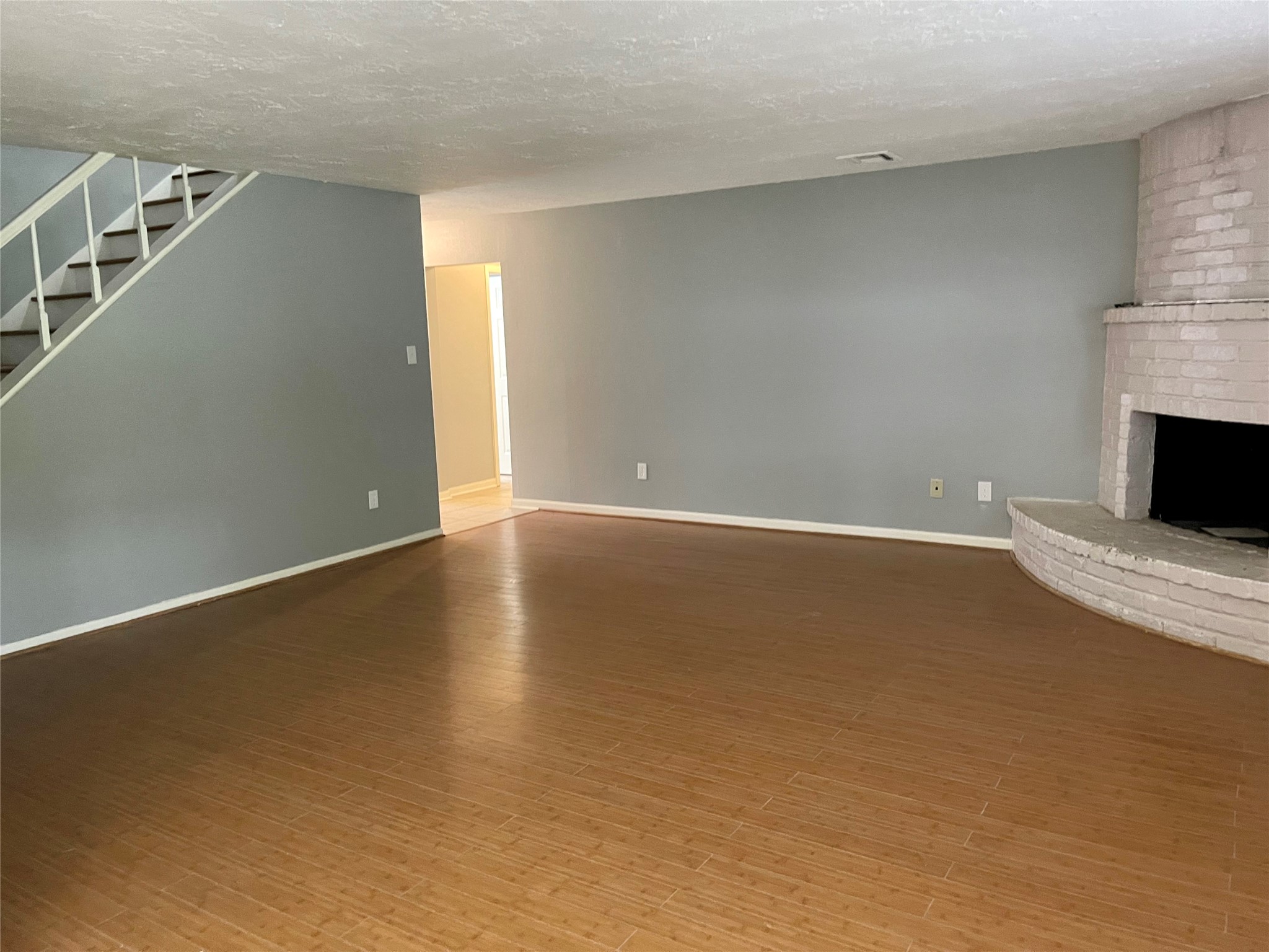 15803 Baytree Drive Houston, TX 77070 - Photo 5 of 23 a view of an empty room with wooden floor and a window