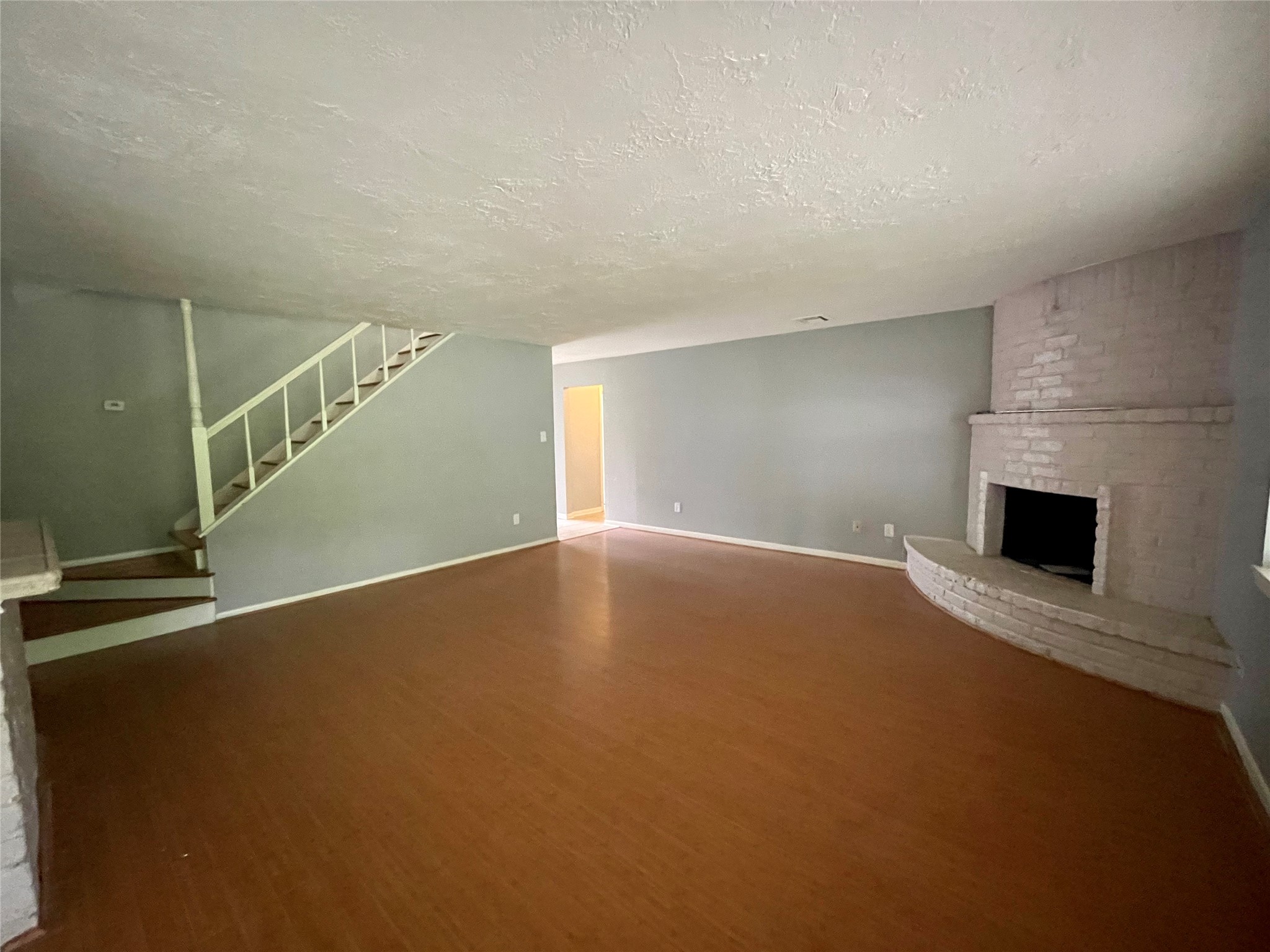 15803 Baytree Drive Houston, TX 77070 - Photo 7 of 23 a view of an empty room with a fireplace