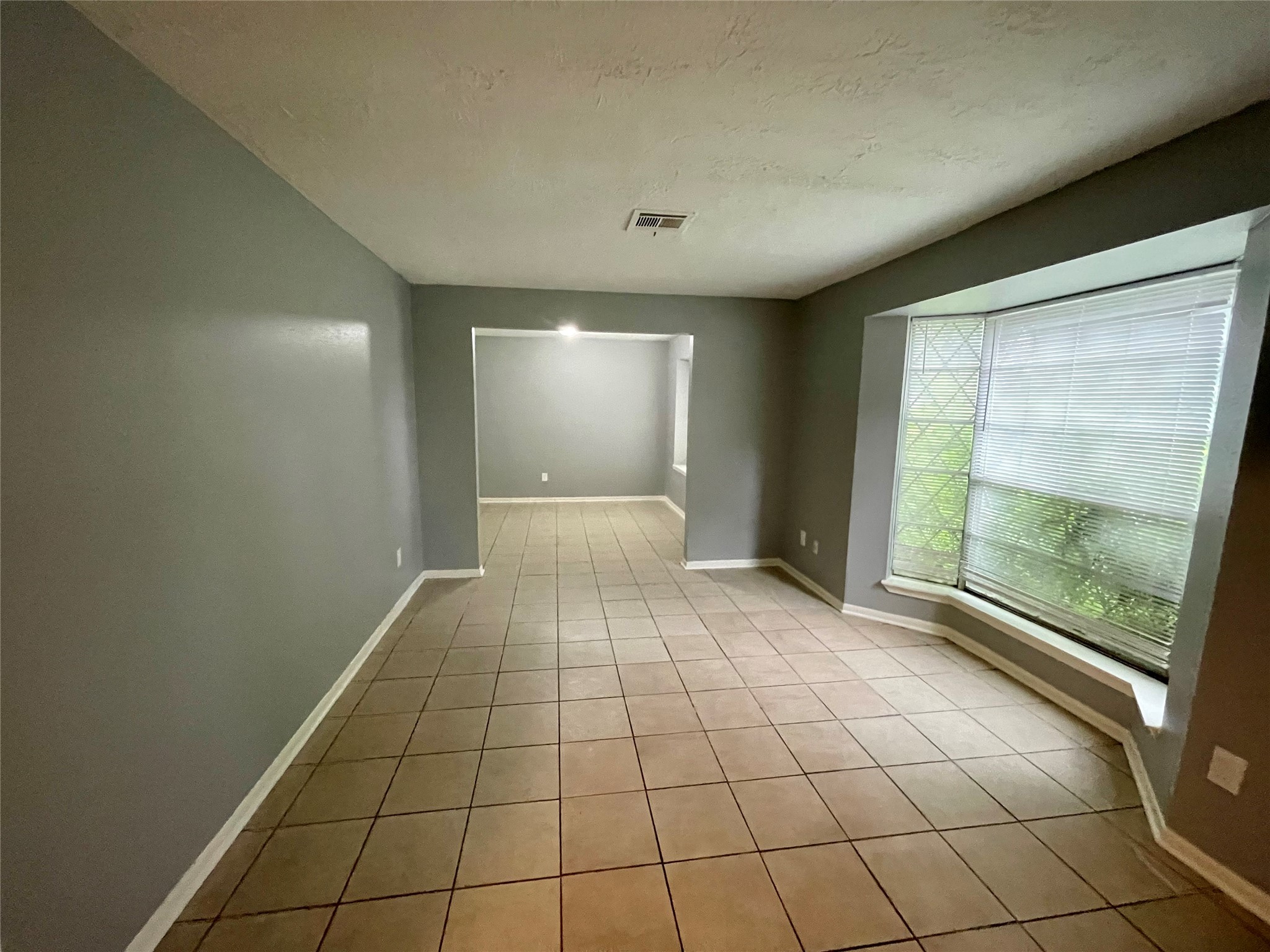 15803 Baytree Drive Houston, TX 77070 - Photo 8 of 23 a view of an empty room and window