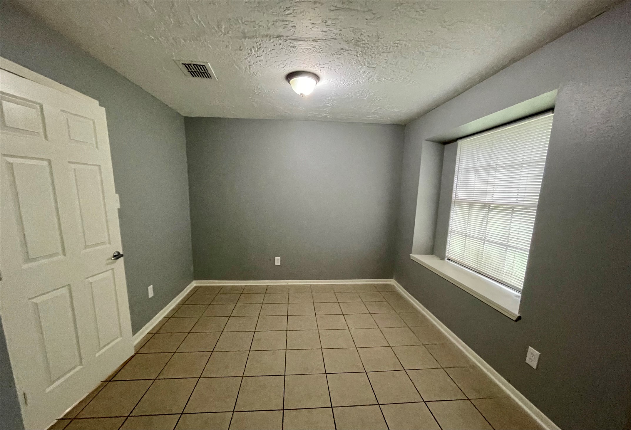 15803 Baytree Drive Houston, TX 77070 - Photo 10 of 23 a view of an empty room and window