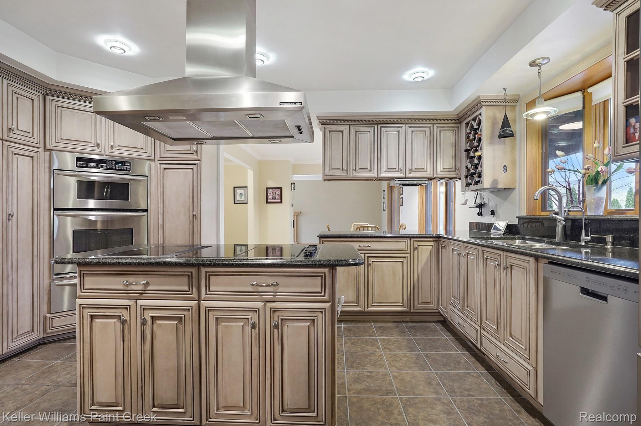 1300 John R Road Rochester, MI 48307 - Photo 25 of 60 Loads of cabinet space & center island cooktop