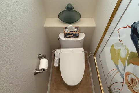 a bedroom with a bed and lamp