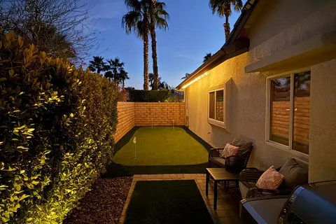 swimming pool view with a outdoor seating space
